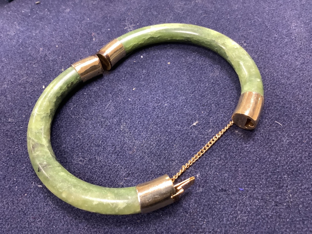 A Chinese jadeite pendant , a pair of bangles, earrings and a cricket pendant